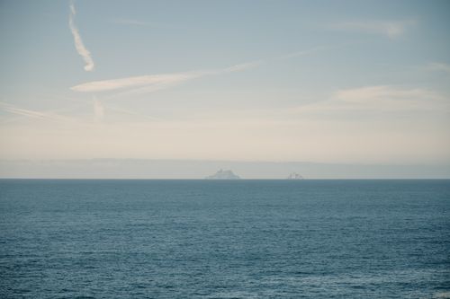 Free Calm ocean view with distant islands under a clear sky, in Ireland. Stock Photo
