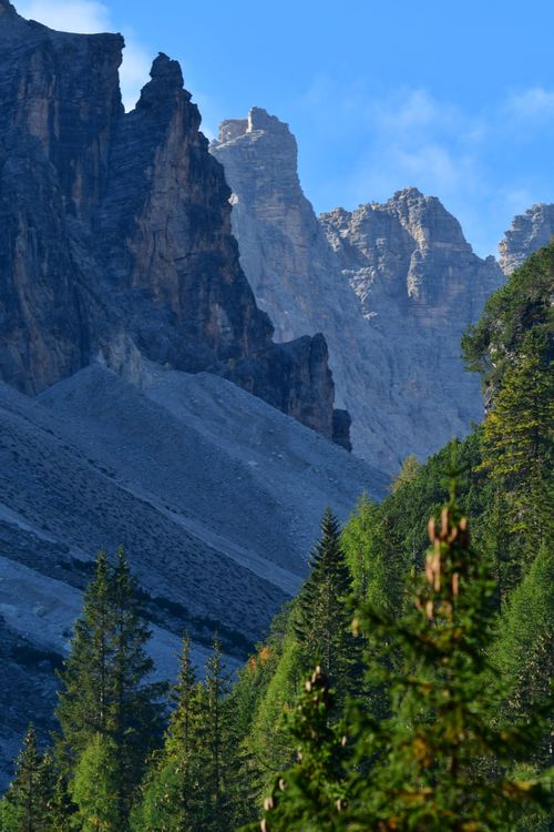 Free Stunning view of the Dolomites with lush green trees and rugged peaks. Stock Photo
