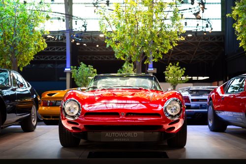 Free Vintage red sports car on display at AutoWorld Brussels exhibition, showcasing classic automotive design. Stock Photo