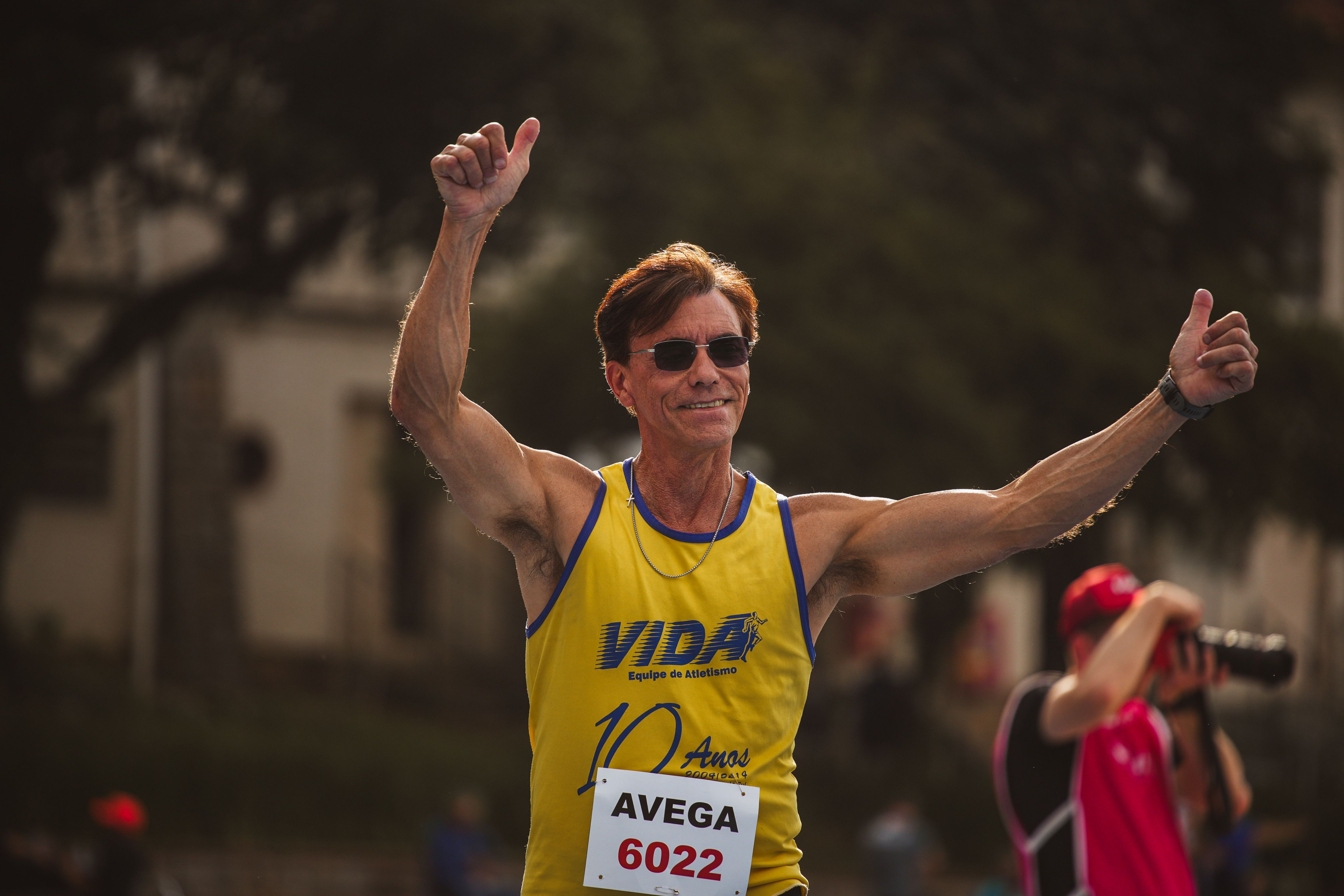 Senior Runner Celebrates Finishing Race · Free Stock Photo