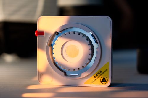 Free Detailed shot of industrial equipment showing a warning label about high temperature Stock Photo