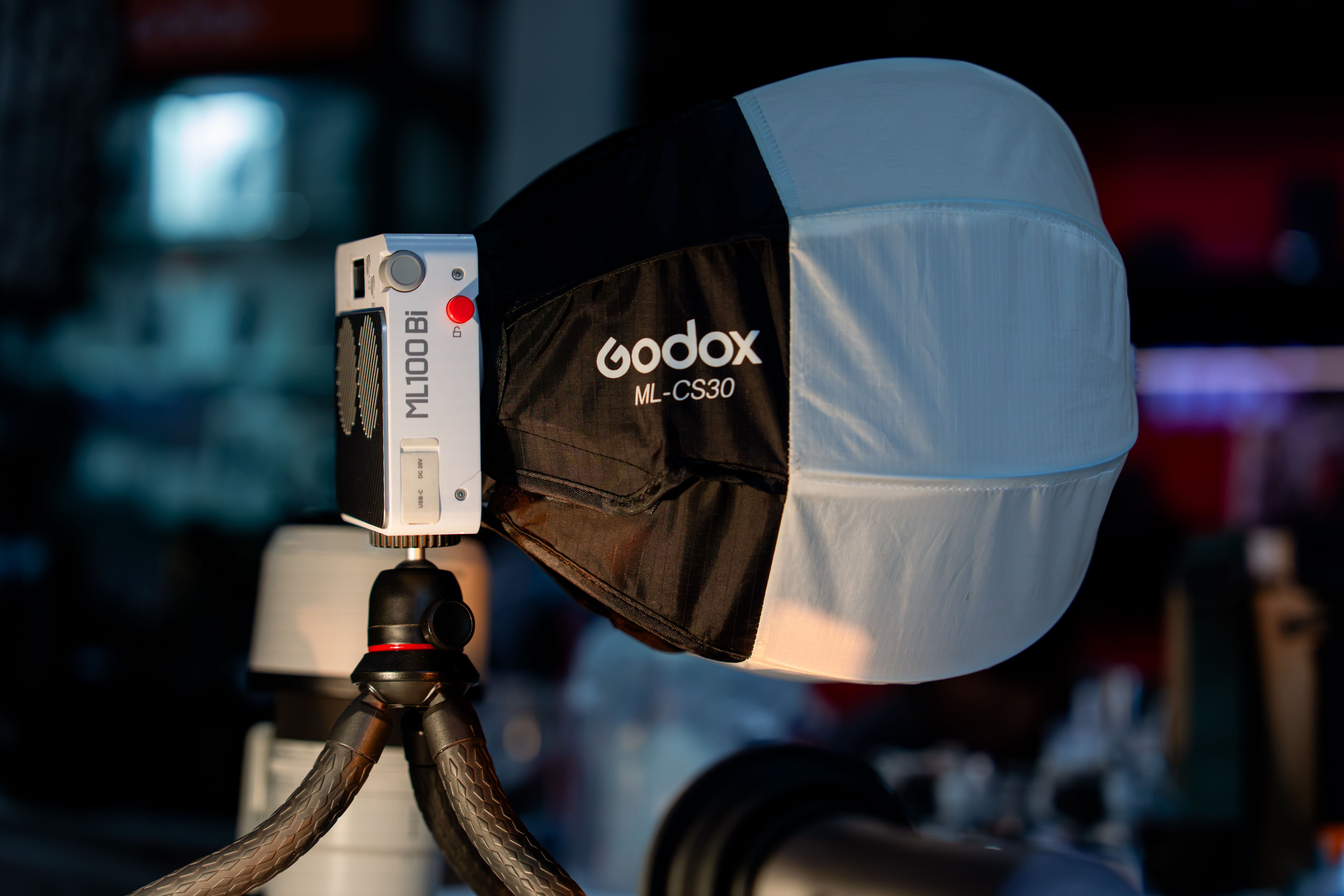 Close-up of Godox ML100Bi with ML-CS30 light modifier in a studio setting.