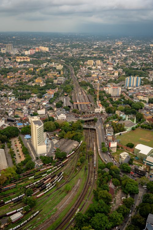 Free A stunning aerial view of Colombo's skyline showcasing a bustling railway and urban landscape. Stock Photo