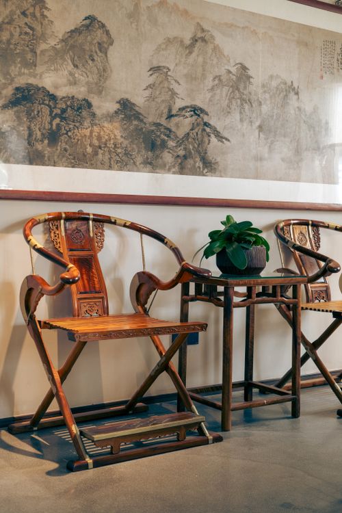 Free Elegant Chinese interior featuring traditional chairs and artwork, ideal for cultural themes. Stock Photo