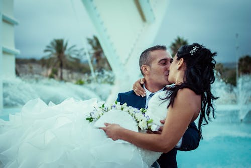 Photo of Married Couple Kissing