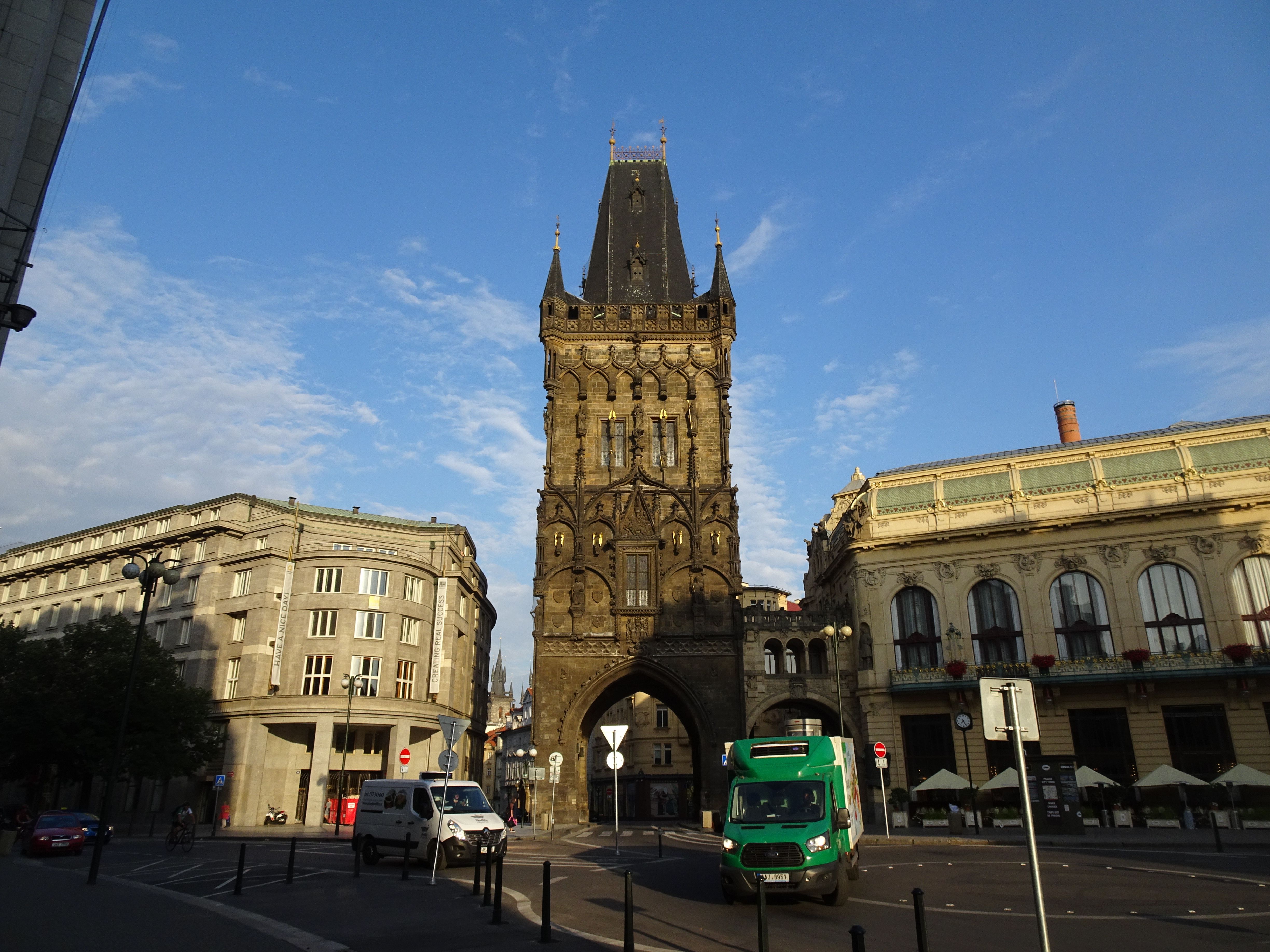 A captivating morning sight of the historic Powder Tower in Prague, under a clear blue sky.