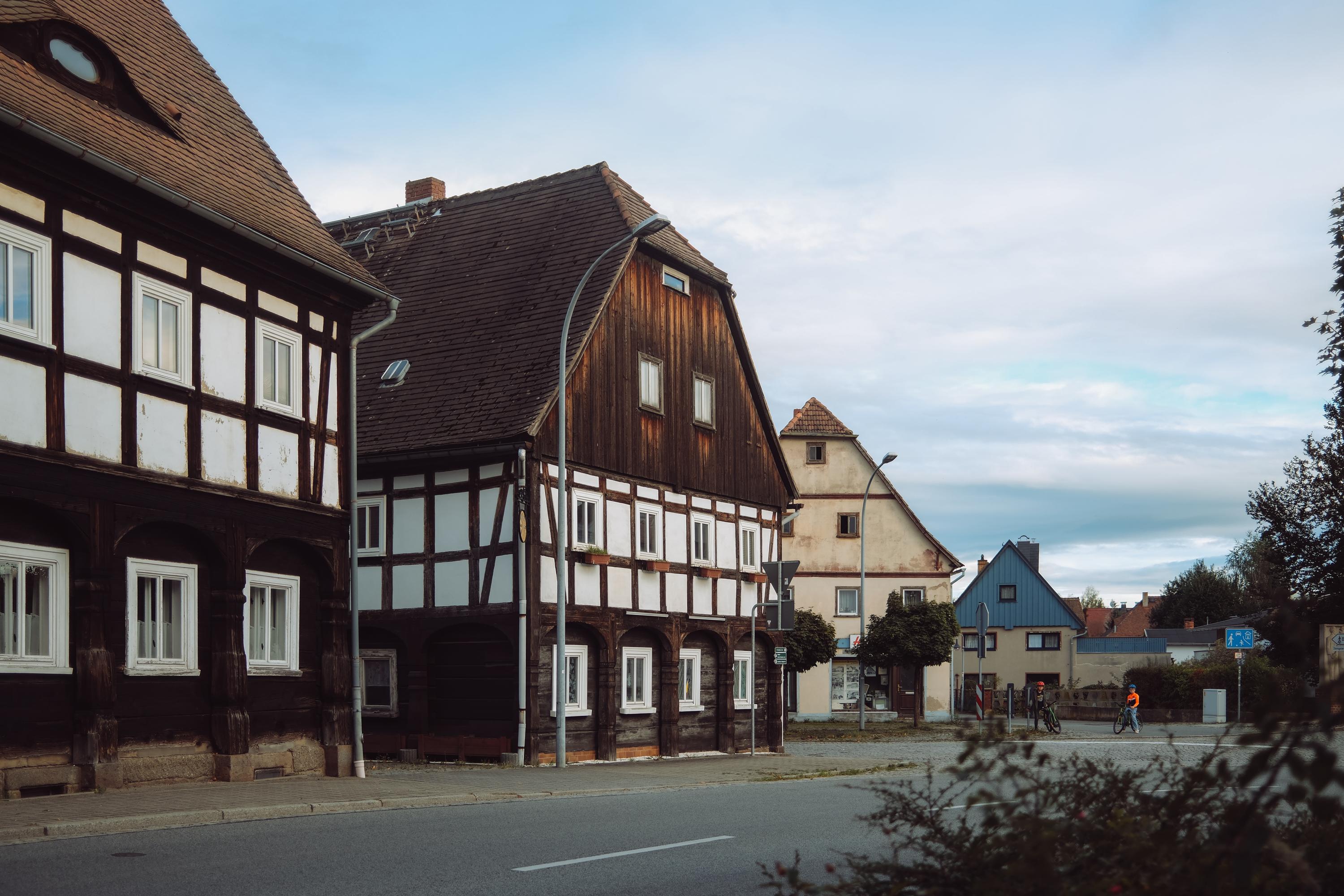 Historic timber-framed houses in a quaint German village setting.
