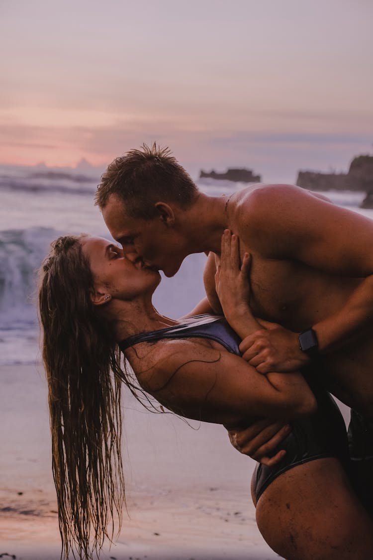 Romantic Couple Kissing At The Beach