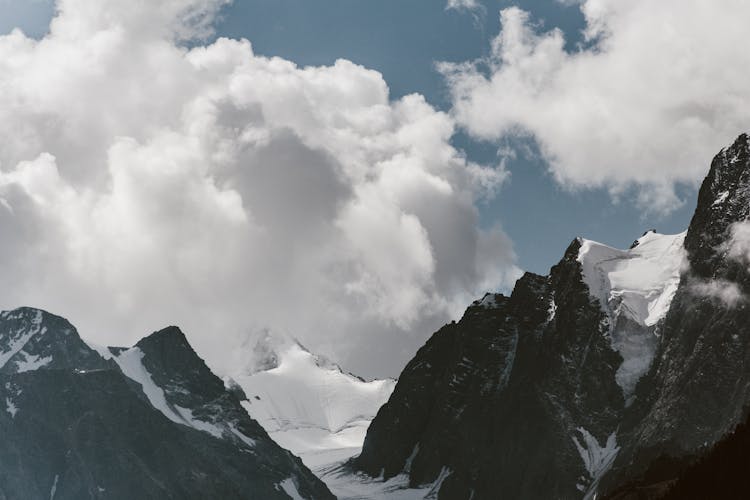 Clouds And Blue Sky Above Mountains