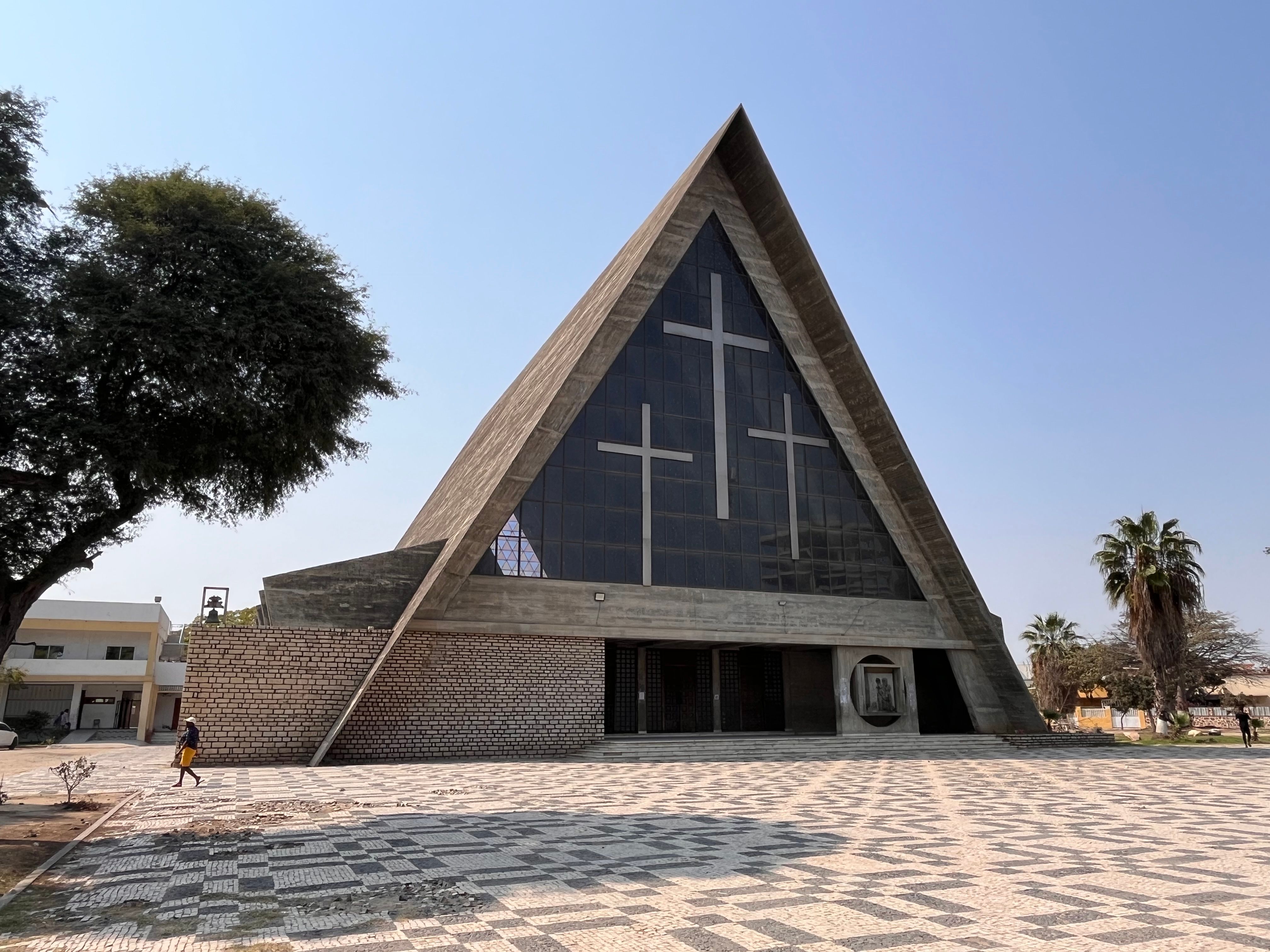A strikingly modern church with geometric design featuring prominent crosses in Angola.