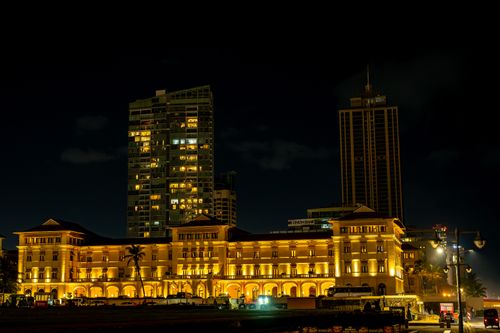 Free A night scene of Galle Face Hotel and high-rise buildings in Colombo, Sri Lanka. Stock Photo
