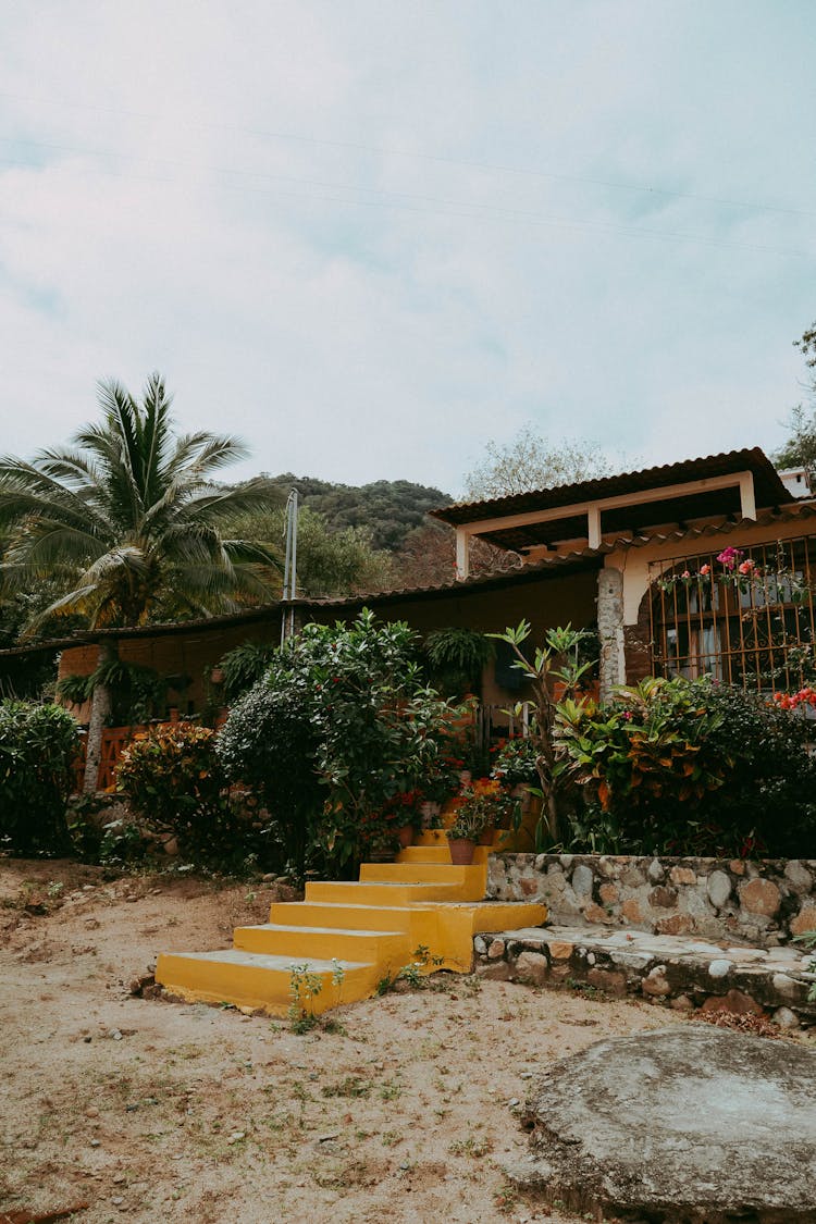 Yellow Stairs In Front Of A House