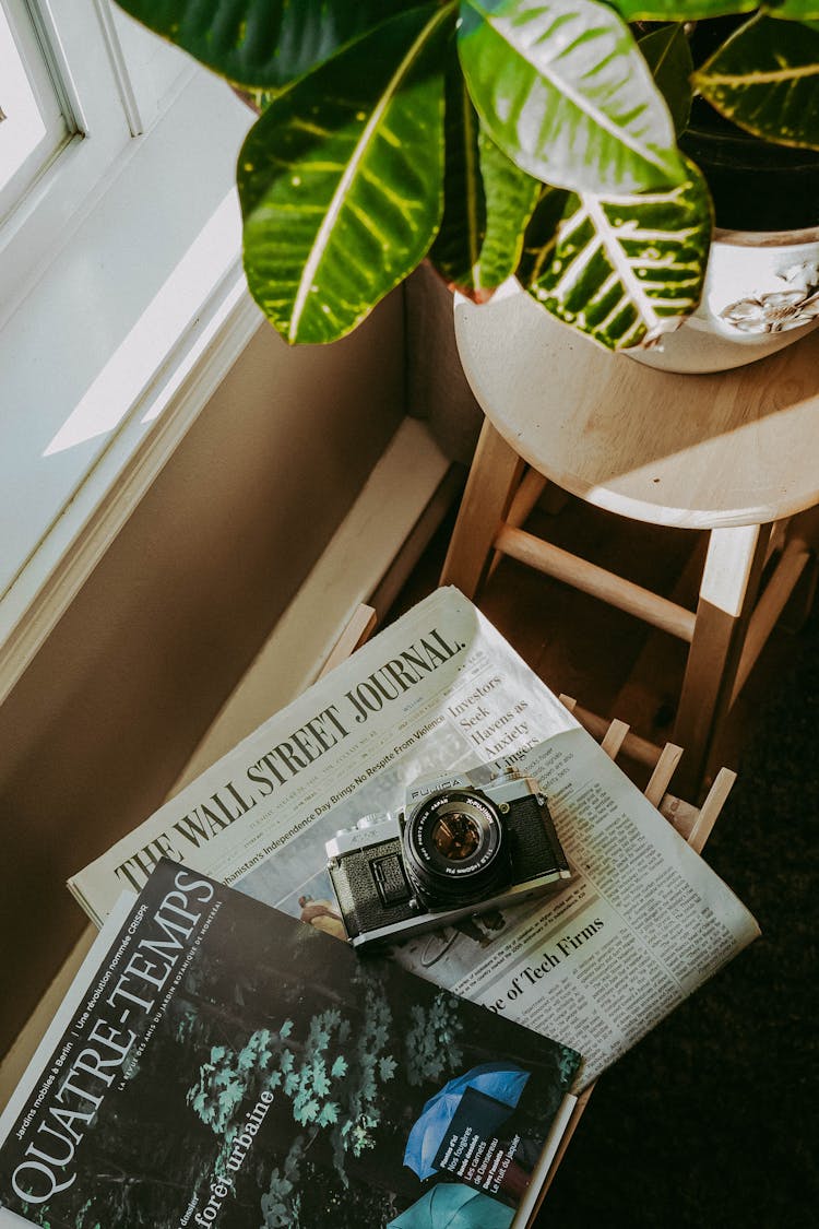 Vintage Camera On Newspaper