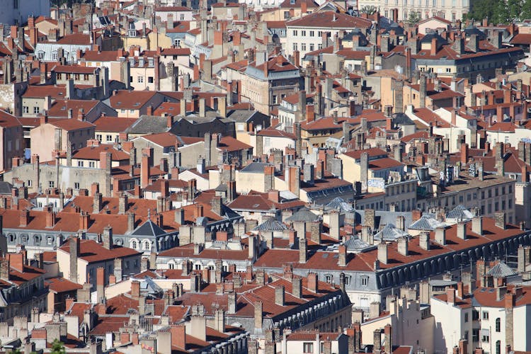 Drone Shot Of Houses And  Buildings With Chimneys 