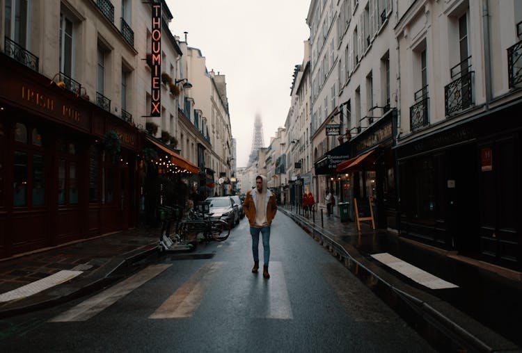 Tourist Strolling Along Street In City Center