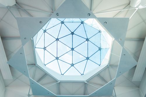 Free A striking geometric skylight design in a modern architectural structure, showcasing intricate metal framework. Stock Photo