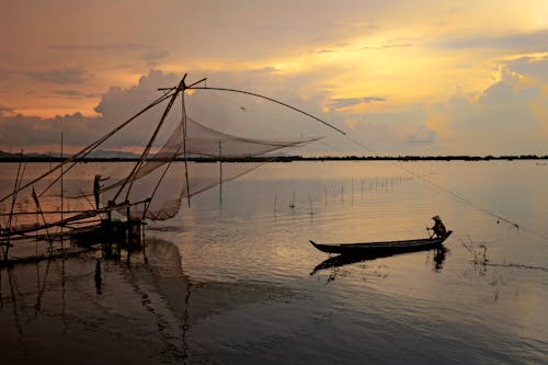 Free Fishermen Working During Sunset Stock Photo