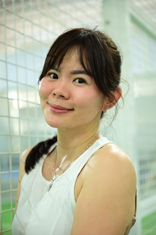 Free Portrait of a smiling woman in a bright indoor environment, looking towards the camera comfortably. Stock Photo