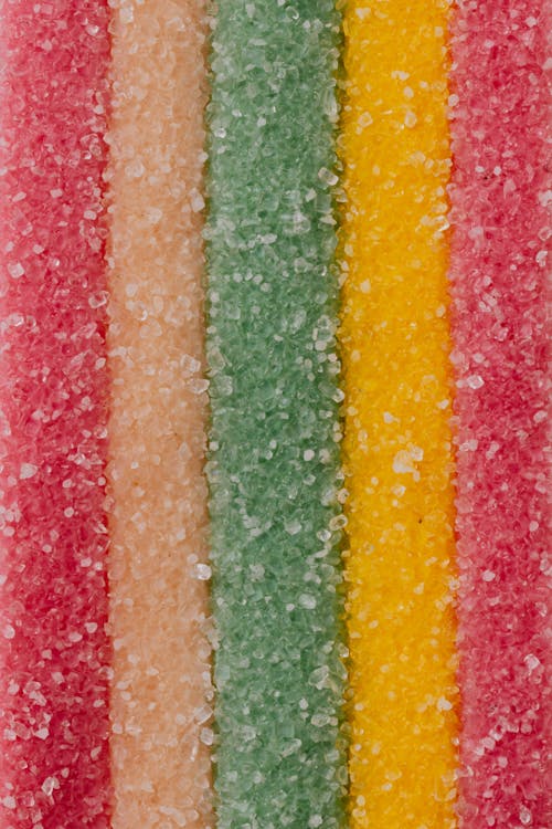 Free Multicolored background of yummy sprinkled sweets placed in vertical lines Stock Photo