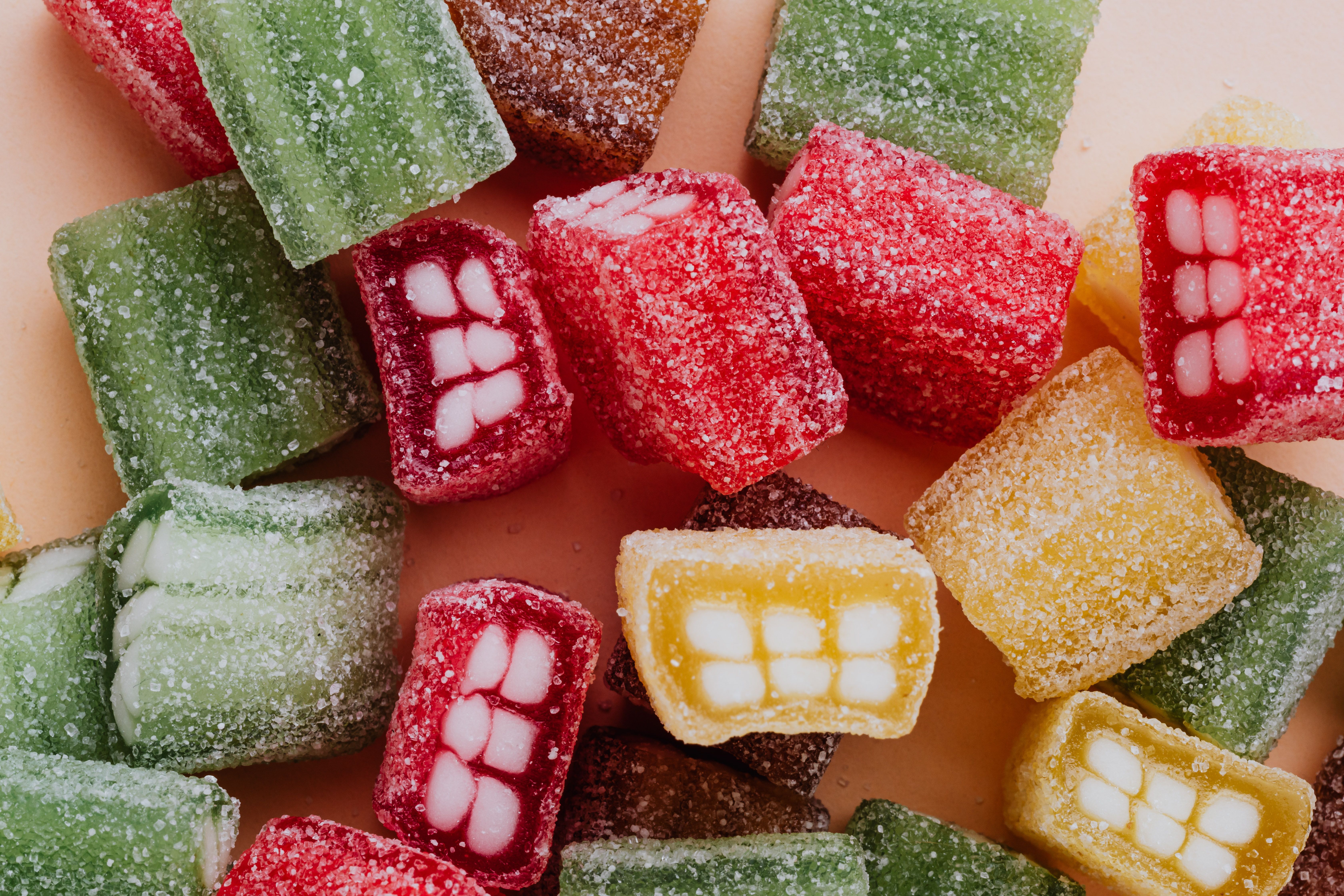 Set of colorful sour gummy sweets in sprinkle assorted chaotically on ...