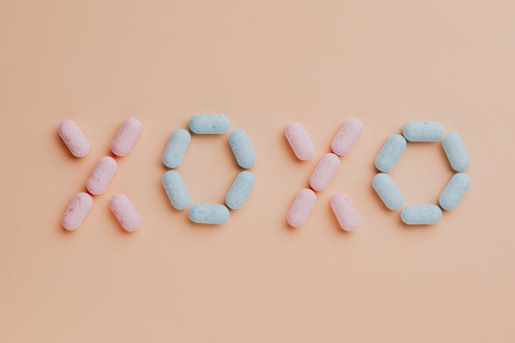 Colorful Candy Dots On Pink Background