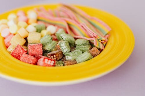 Tasty colorful gumdrops in plate