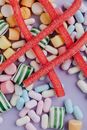 Multicolored candies on lilac surface