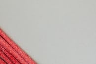 Long red chewy marmalade candy on gray background