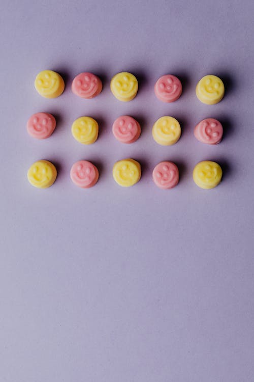 Free Pink and Yellow with Smiley Face Gummies Stock Photo