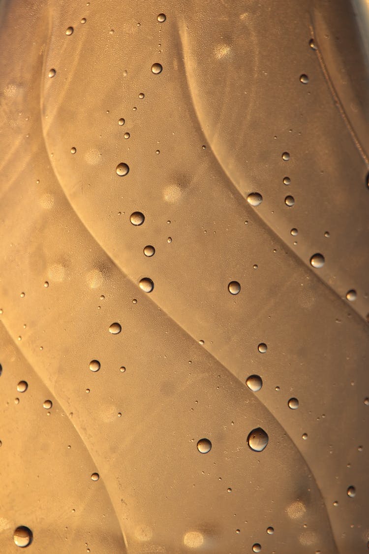 Water Droplets On Gold Surface