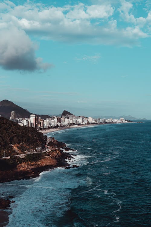 Free Drone Shot of Waves Crashing on the Coastal Area of Rio de Janeiro Stock Photo