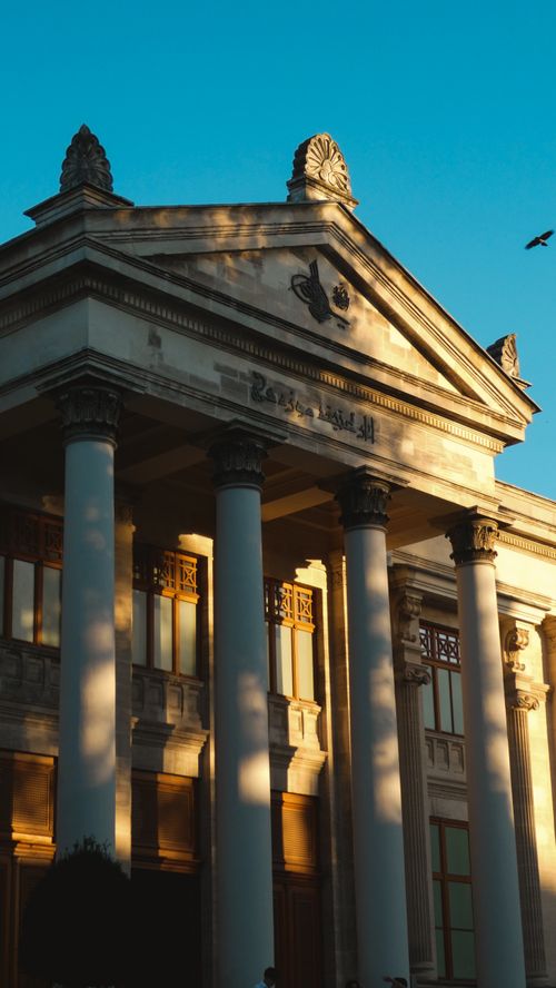 Free Sunlit facade of an Ottoman revival architectural building in Istanbul with carved details. Stock Photo