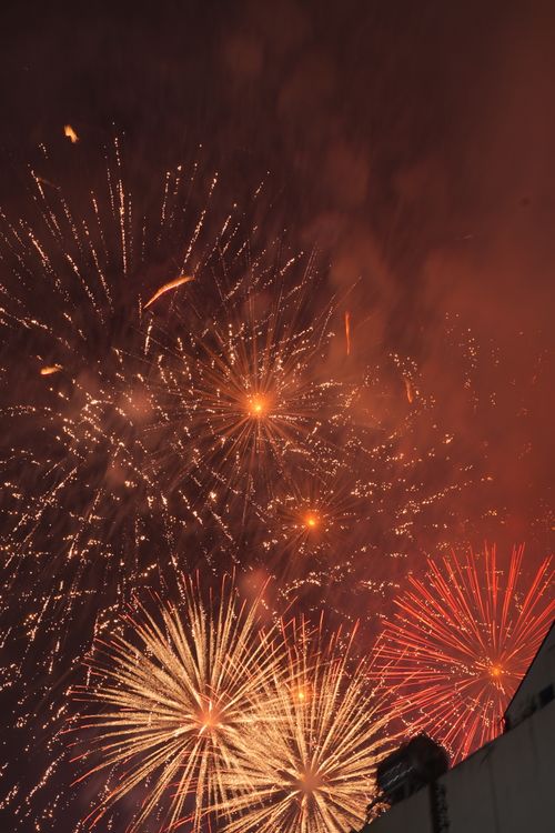 Free Explosive fireworks burst brightly in the dark night sky, creating a stunning visual celebration. Stock Photo