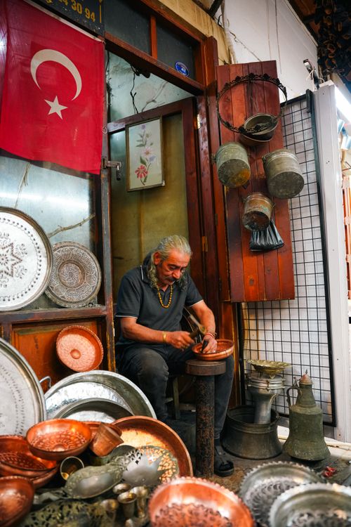 Free A craftsman creating copperware in a Gaziantep market, showcasing Turkish culture. Stock Photo
