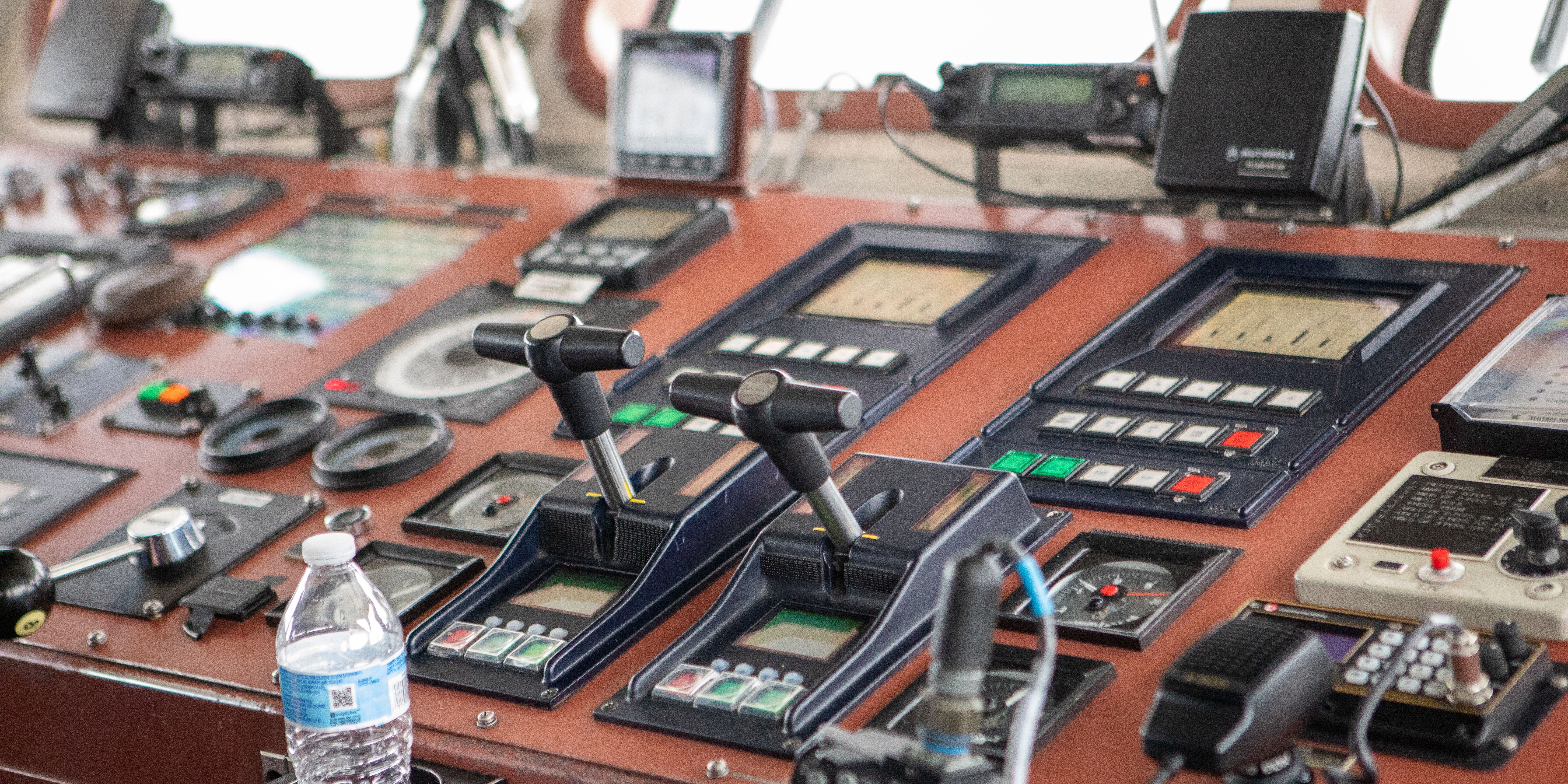 Temsilî fotoğraf: Close-up view of a ship's control room showcasing navigation equipment and controls.