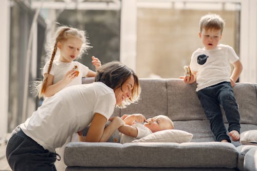 Free Happy mother playing with children at home Stock Photo