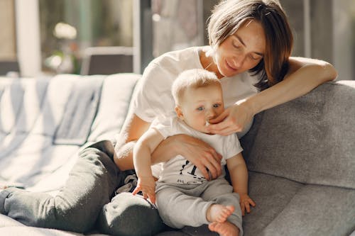 Free Woman Taking Care of the Baby Stock Photo