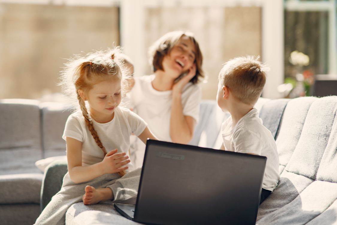 A mother spending warm, connected time with her children indoors