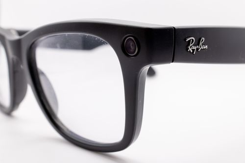 Free Detailed close-up of a black eyeglasses frame with branding on the temple. Stock Photo