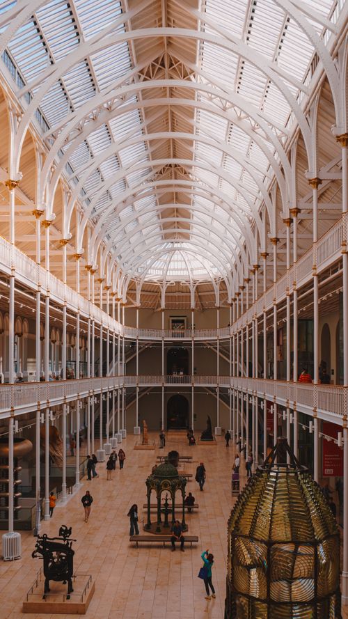 Free Beautiful architecture and visitors inside the National Museum of Scotland in Edinburgh. Stock Photo