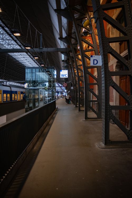 Free A contemporary train station platform featuring industrial architecture and modern amenities. Stock Photo