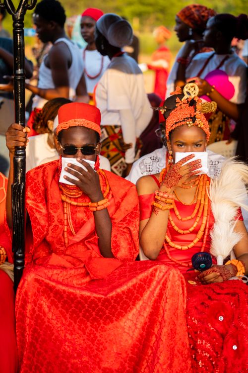 Free Colorful African traditional wedding attire with ornate jewelry and cultural details. Stock Photo