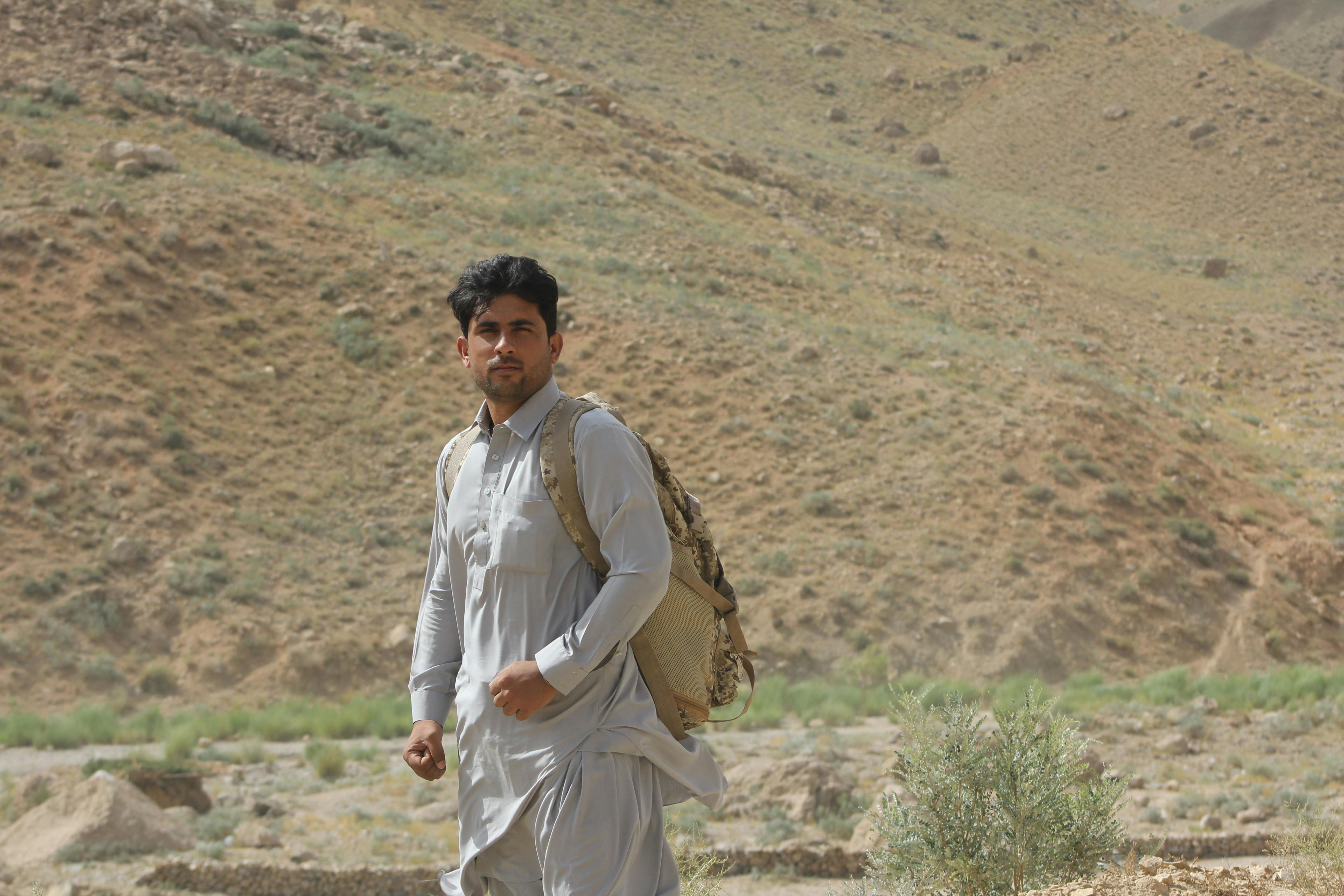 Technician repairing a modern smartphone with tools on a workbench