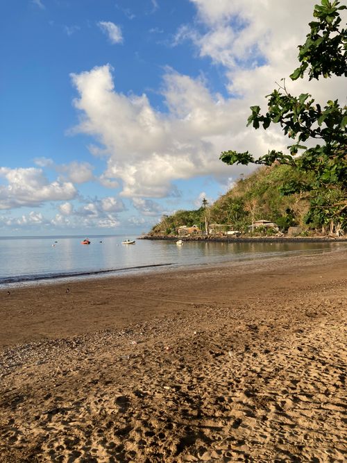 Free Serene beach scene in Mayotte with calm water and blue skies. Stock Photo