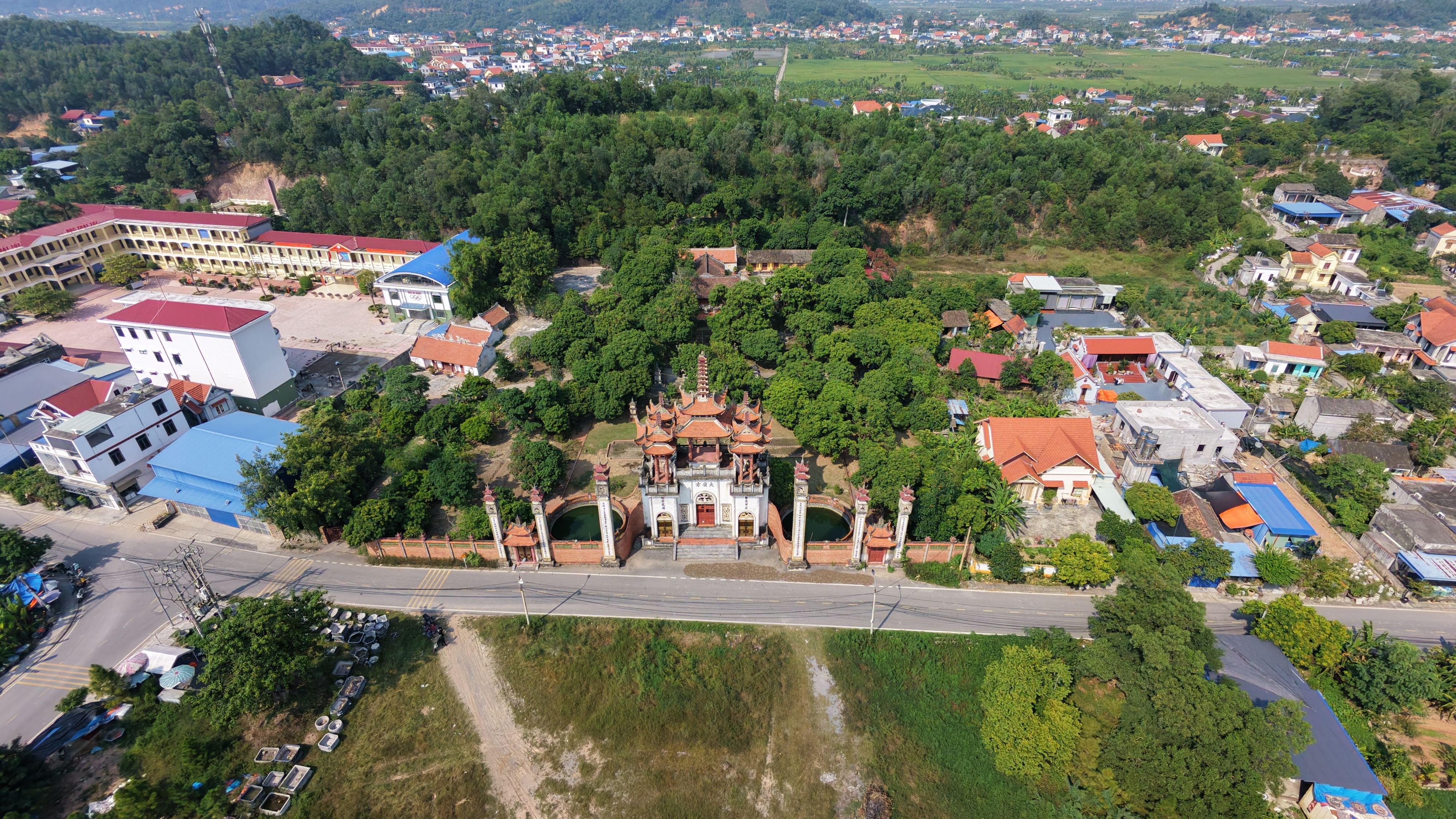 Stunning aerial view of a Vietnamese temple complex surrounded by greenery in Hai Phong, Vietnam.