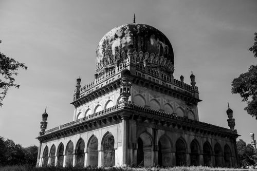 Free Explore the architectural grandeur of the Qutb Shahi tomb in this striking black-and-white photograph, capturing historic Hyderabad. Stock Photo