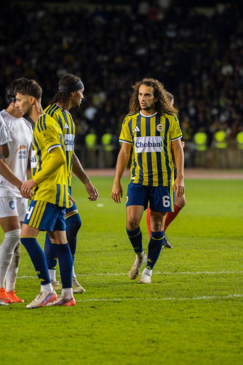 Free Intense soccer match in Baku featuring athletes in action on the field. Stock Photo