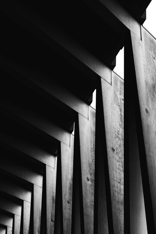 Free Black and white abstract photo of modern architectural beams creating geometric patterns. Stock Photo