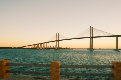 Free Stunning view of Ponte Newton Navarro over calm waters at sunset in Natal, Brazil. Stock Photo