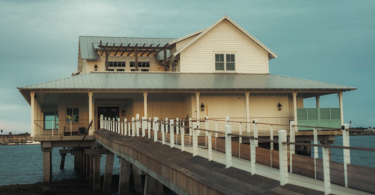 A charming waterfront house in St. Augustine, Florida, captured during the serene golden hour.